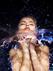 Wet woman face with water drop.