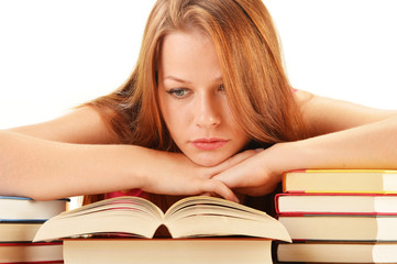 Young woman reading a book. Female student learning