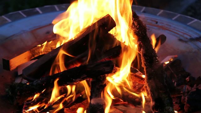 Wood Burning Fire Pit with Orange Flames at Night 1080p