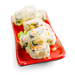 traditional fresh japanese sushi rolls on a white background