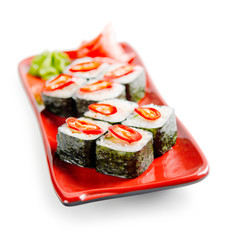 traditional fresh japanese sushi rolls on a white background