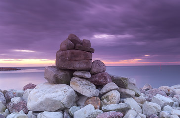 Piling of rocks, baltic ocean in the background