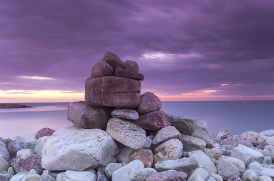 Fototapeta Piling of rocks, baltic ocean in the background