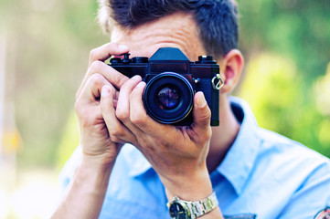 young photographer takes pictures