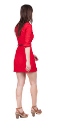 back view of walking woman . going gir in motion. Rear view peop