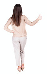 Back view of  woman thumbs up.