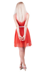 back view of standing young beautiful  woman.