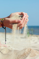 Holding beach sand in hands