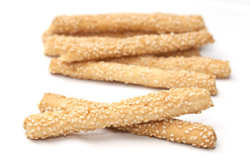 Baking bread with sesame stick isolated on the white background