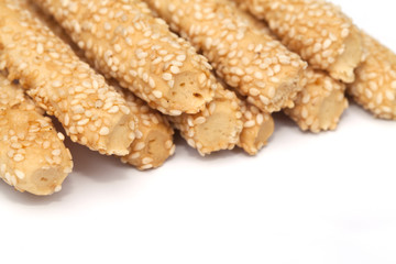 Baking bread with sesame stick isolated on the white background