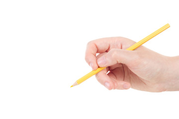 Caucasian hand with yellow pencil