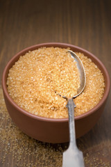 brown sugar in a bowl and spoon, selective focus