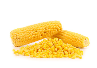Two corncobs and handful canned corns.