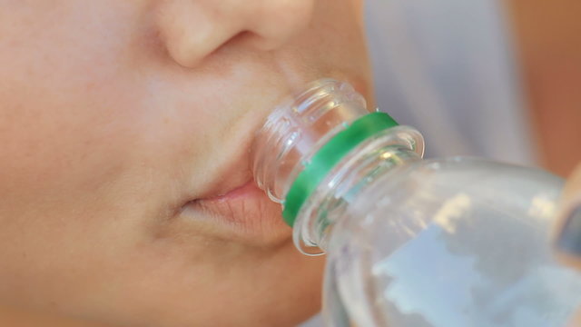 close-up of a girl who drinks water