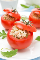 tomatoes stuffed with tuna salad and bulgur on the plate
