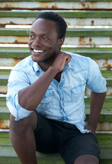 Black man smiling outdoors