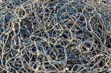 Pile of fishing nets on beach