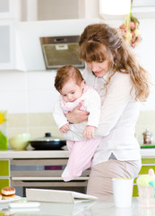 mother and her little daughter with tablet pc