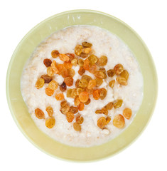 oat porridge with raisins in yellow bowl