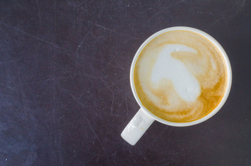 Latte on the black table
