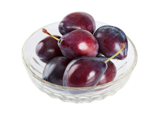 Ripe plums in a dish