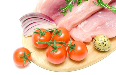 cherry tomatoes and raw meat close up on white background