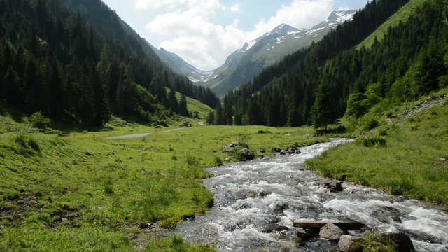 Stream water and landscape of Zillertal Alps