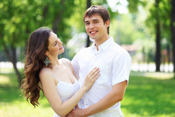 Young love Couple smiling under blue sky