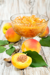 peach jam and fresh fruits with leaves