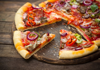 Pizza with ham, mushrooms and cheese