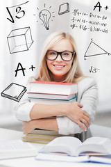 student with stack of books and doodles