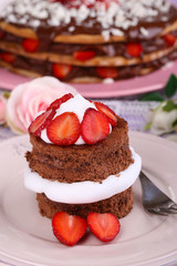 Chocolate cake with strawberry on wooden table close-up