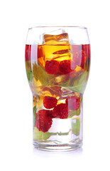 Iced tea with raspberries and mint isolated on white