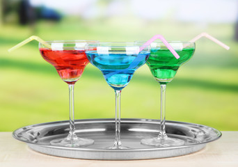 Different cocktails on bright background
