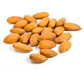 Heap of almond nuts isolated on white background
