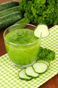 Green vegetable juice on table close-up