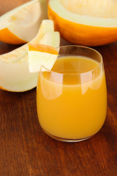 Delicious juice of melon on table close-up