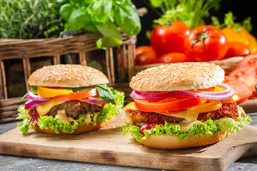 Two homemade hamburgers with fresh vegetables