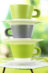 Three cups on nature background