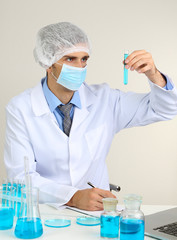 Young laboratory scientist working at lab