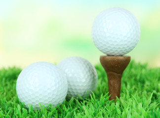 Golf ball  on green grass outdoor close up