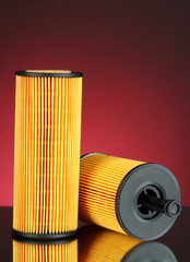 Car oil filters on dark color background