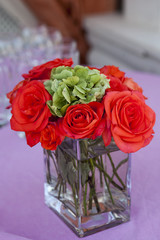 red rose "Grand" in the transparent  glass vase