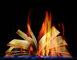 Open book in flame on black background