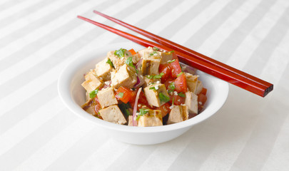 Grilled tofu tossed together with tomatoes, onions, and cilantro