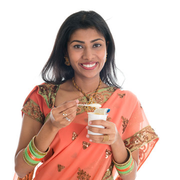 Traditional Indian Woman Eating Yogurt