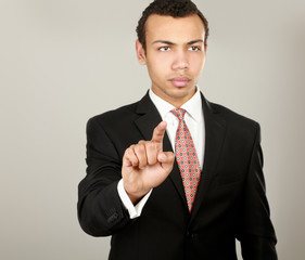 A businessman showing something isolated on white background