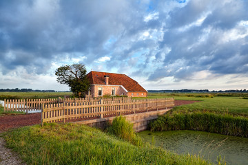 Fototapeta na wymiar charming farmhouse and blue sky