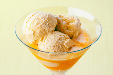 cup homemade ice cream and orange juice