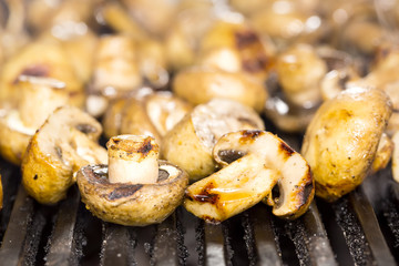 Cooking mushrooms on the grill in the restaurant